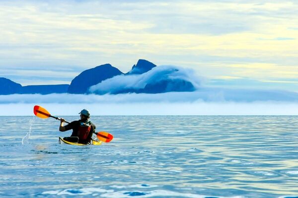 men-kayak-open-sea-summer